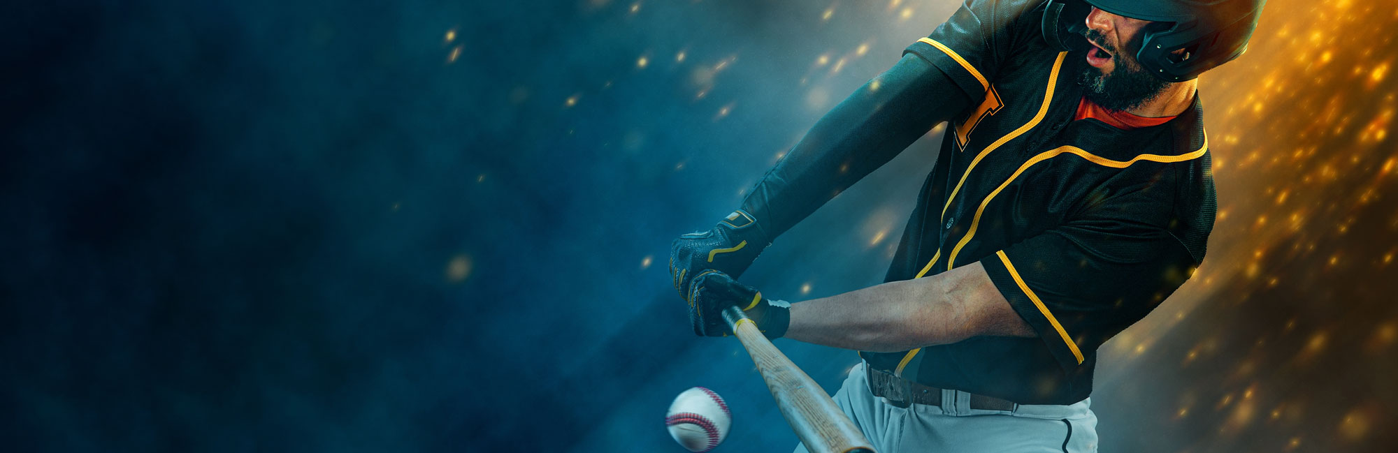 A baseball player in a black and yellow uniform swings a bat at a fast-approaching ball, with a dramatic blue and orange background.