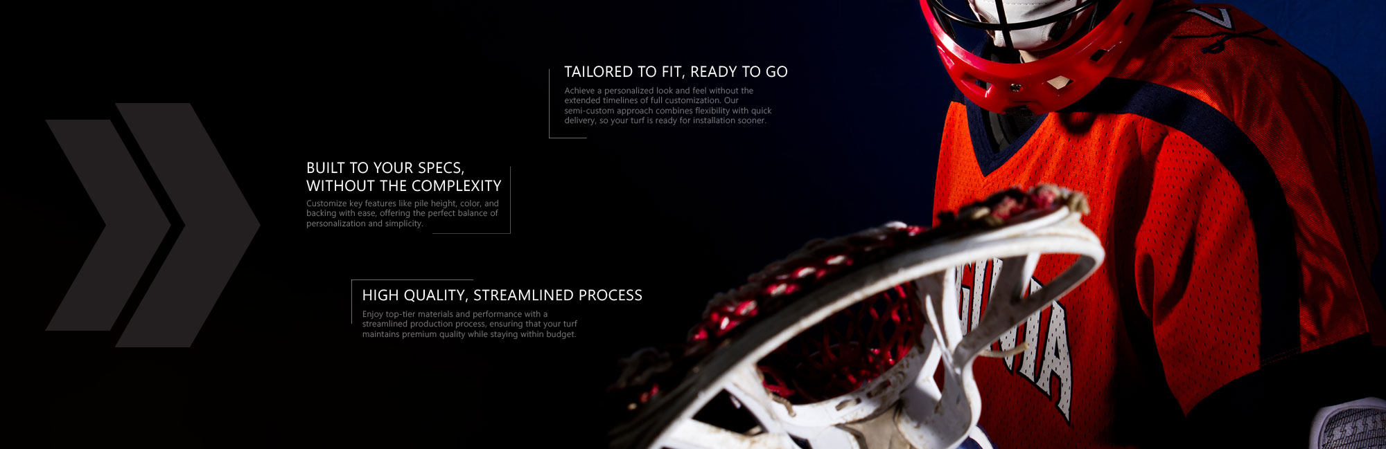 Lacrosse player in red uniform holding a lacrosse stick with a netted head, ready for action under stadium lights.